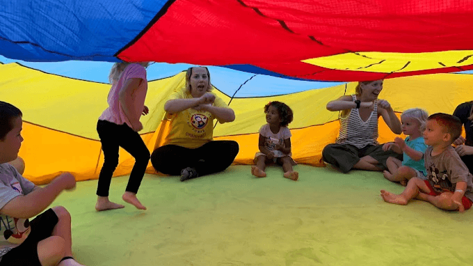 Bring your child into the fun with colorful parachute play that combines movement, music, and cooperation. These activities for children in Cypress encourage participation and give families a joyful way to connect with others.