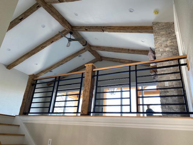 Reclaimed Beams, Hand hewn Wood Ceiling Beams are used for this stunning ceiling.
Reclaimed wood Beams accent the staircase. Using Beams for Newel Post and black rod iron Balusters.
Ohio