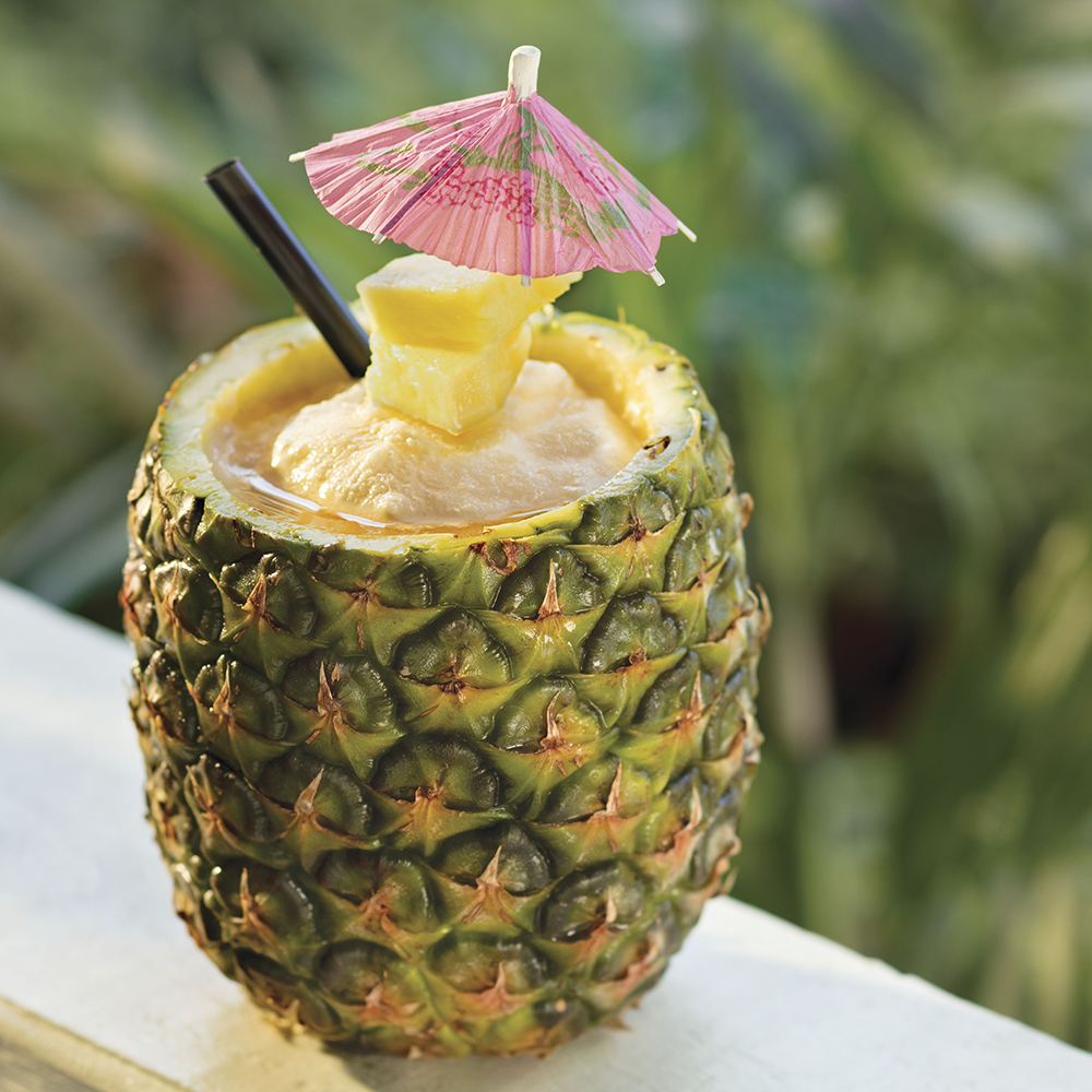 Ultimate Pineapple - With spiced rum, Coco LoÌpez & Bacardi Black Rum swirled with strawberry ice and served in a freshly cut pineapple.