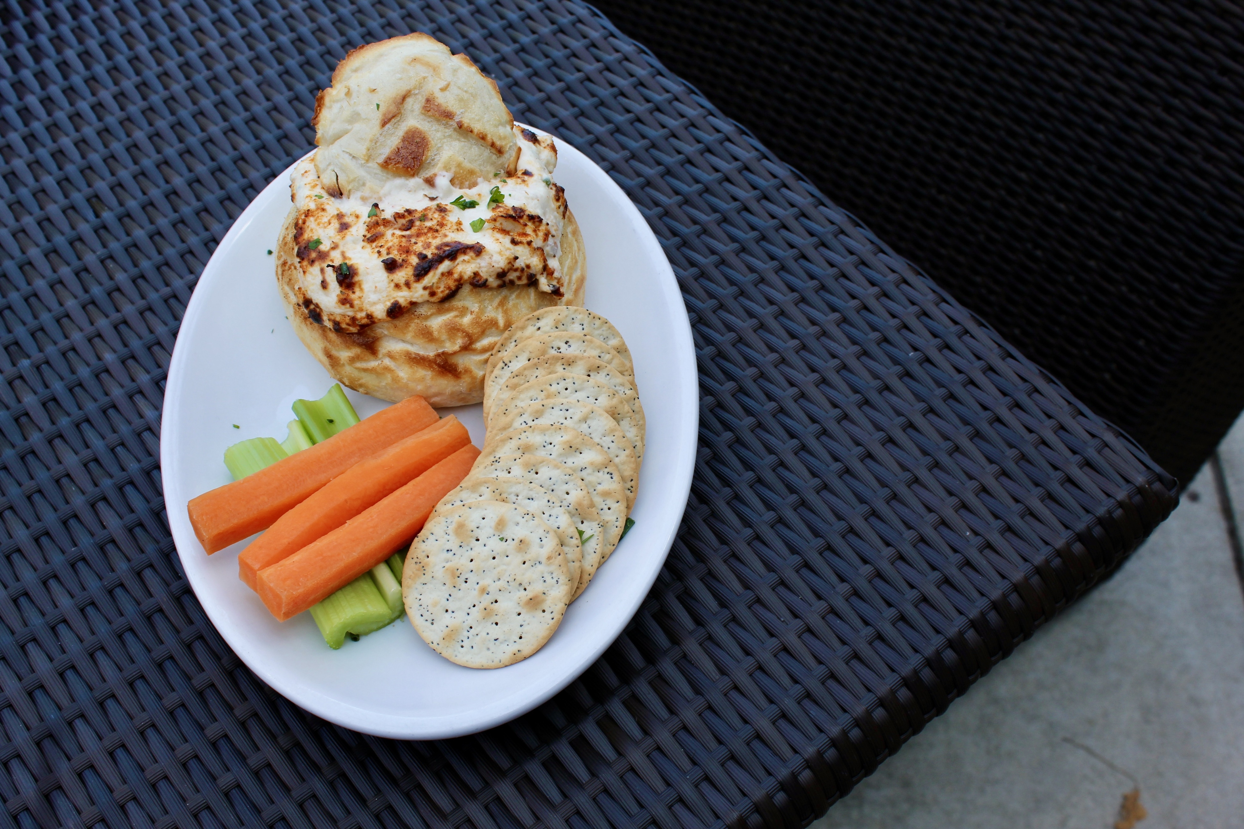 Mama's On The Half Shell Crab Dip made with jumbo lump crab meat, served in bread bowl with accoutre 