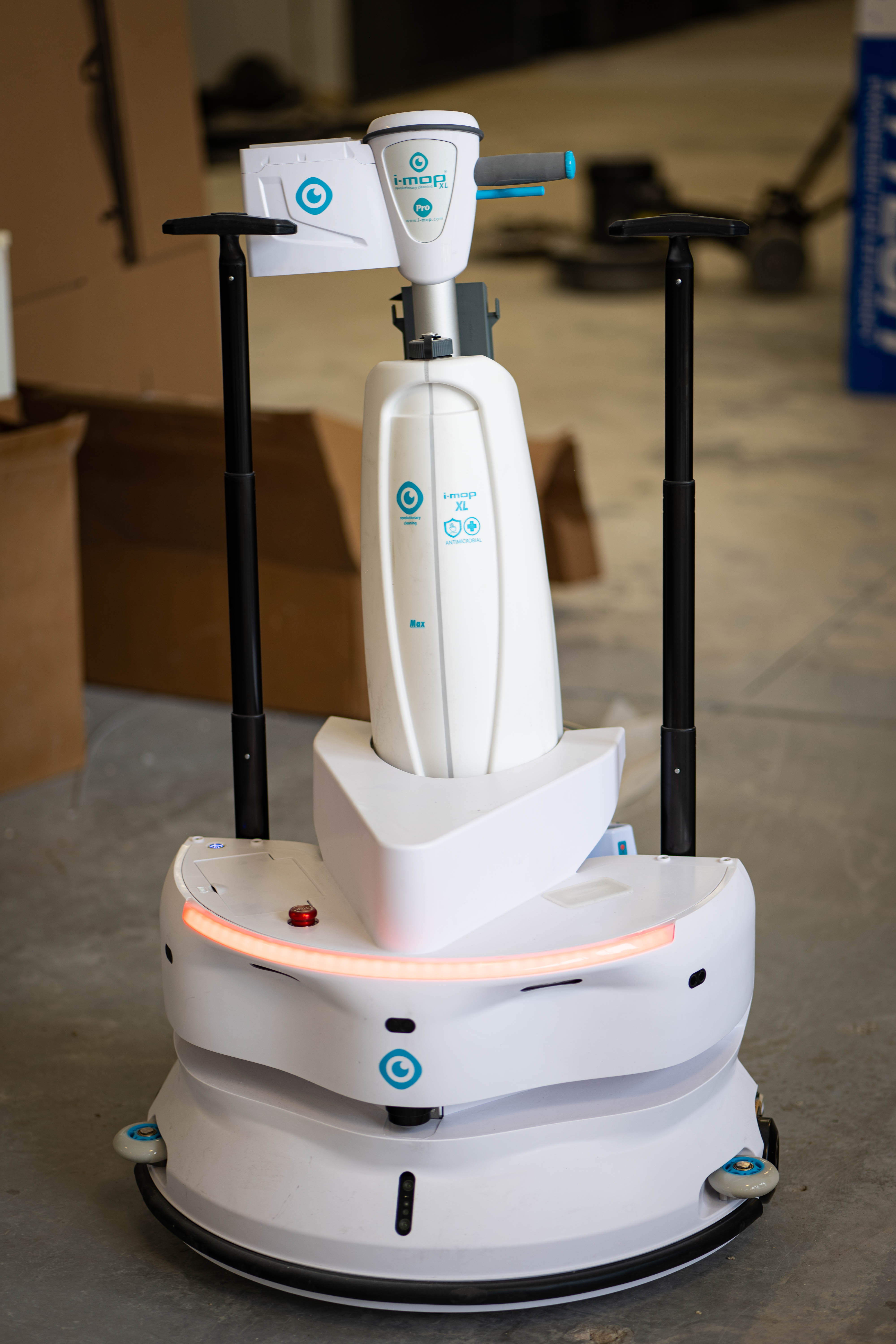 A detailed view of an advanced i-mop XL autonomous robotic floor scrubber stationed at the WaySolutions repair shop. As commercial cleaning transitions into smart technology, our Layton facility is fully equipped with the specialized tools and expertise required to calibrate, maintain, and repair next-generation robotic fleets for high-traffic retail environments.