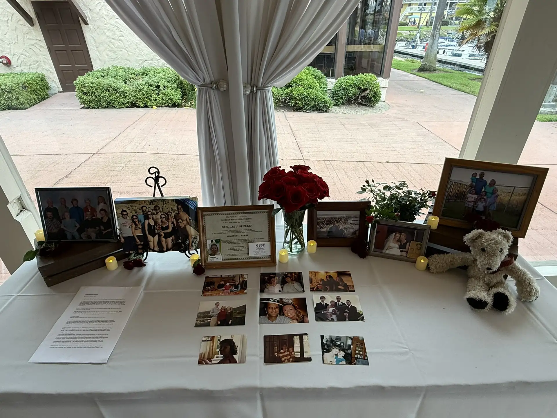 Exquisite table centerpiece featuring photo-montage in memory of a loved one