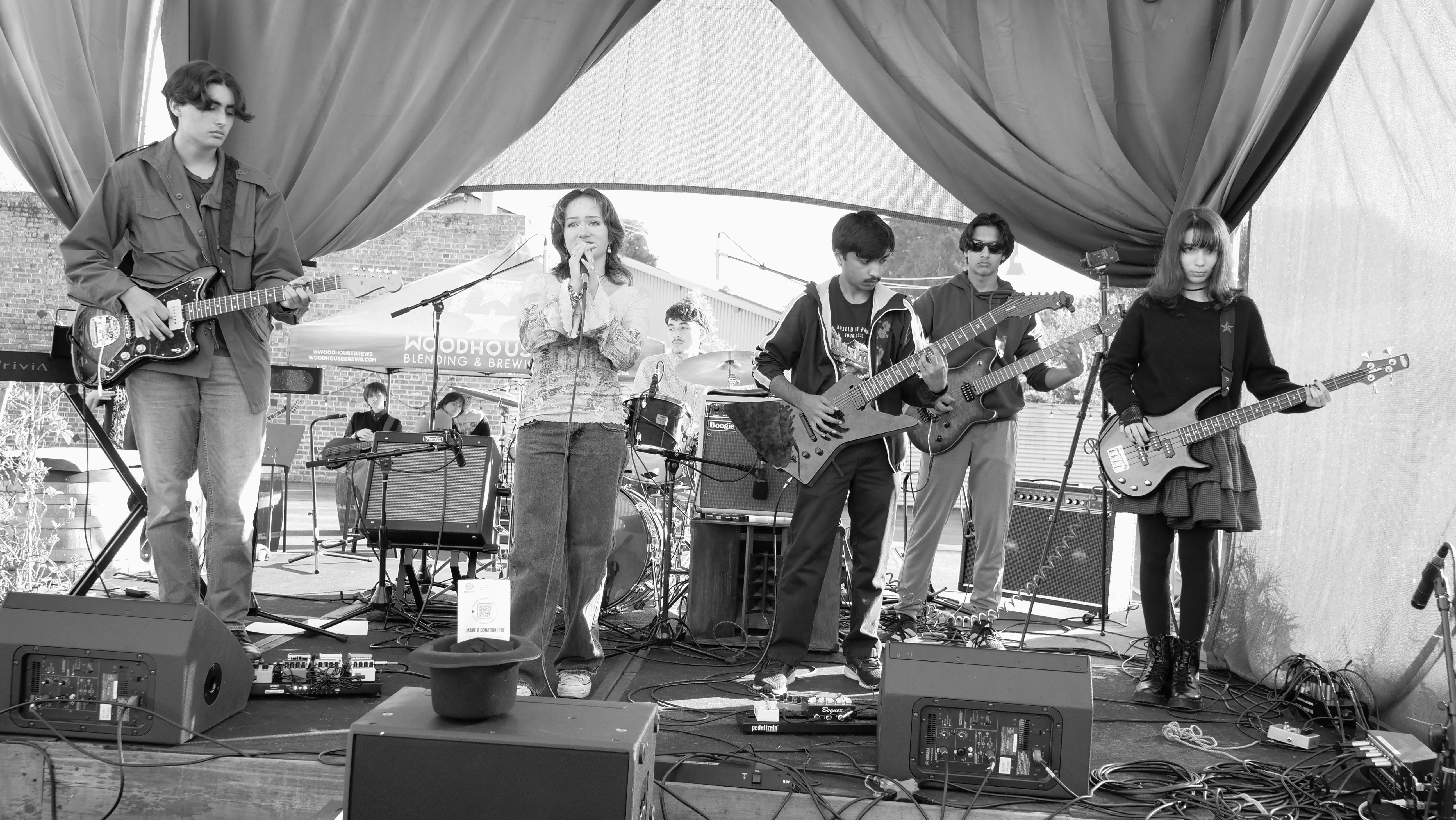 Black-and-white photo of a student band performance showcasing live music instruction and ensemble training.