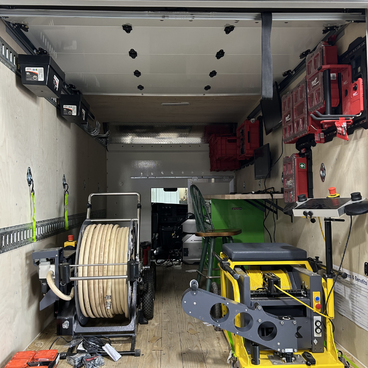A look inside a fully stocked Hydromax Services truck &mdash; professional drain cleaning machines, hydro jetting hose reels, and sewer equipment ready for residential and commercial service calls across the Evansville tri-state area.