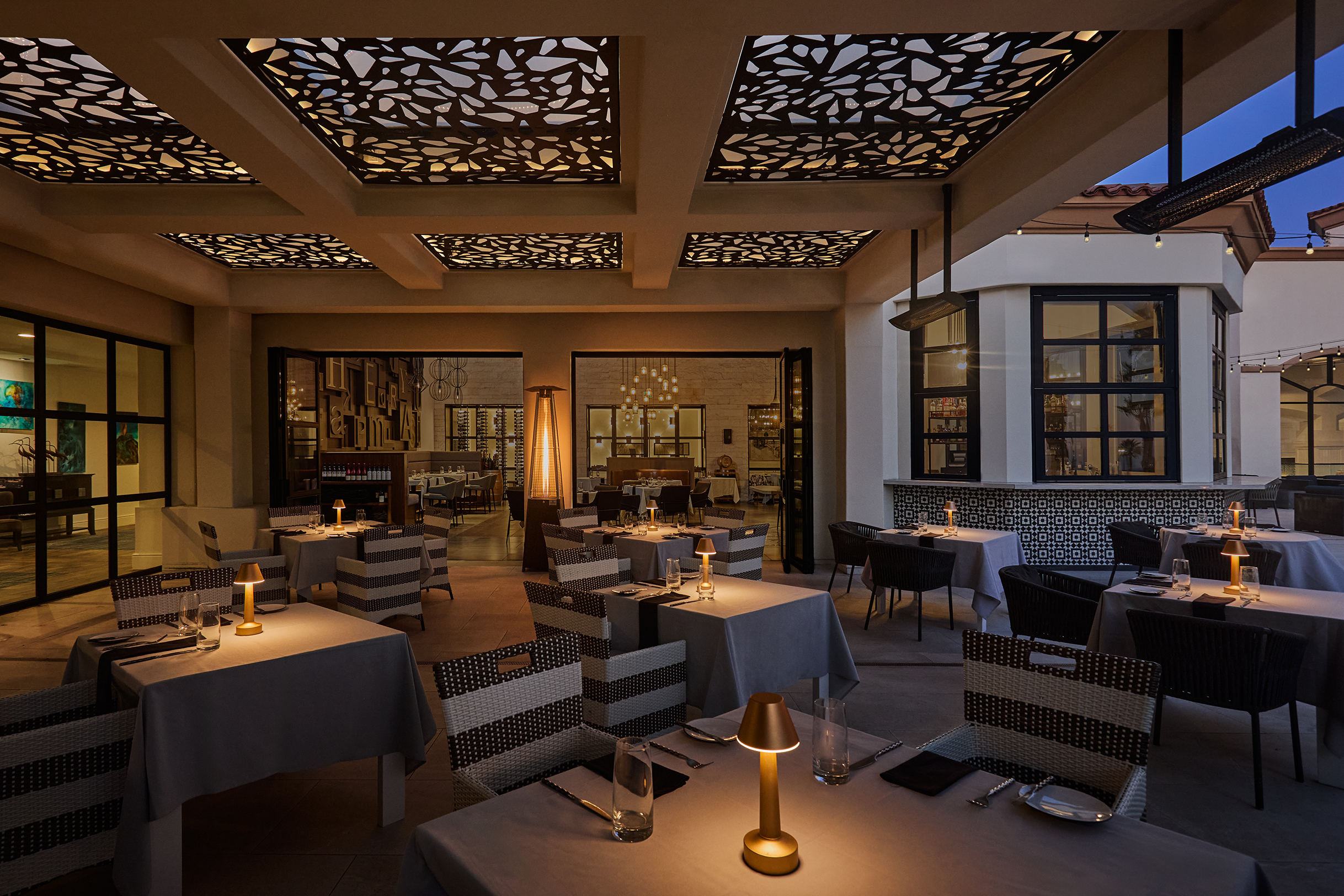 Outdoor patio seating looking inside at Henry's Coastal Cuisine