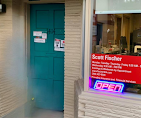Front entrance of the Scott Fischer insurance office where local customers visit for insurance services.