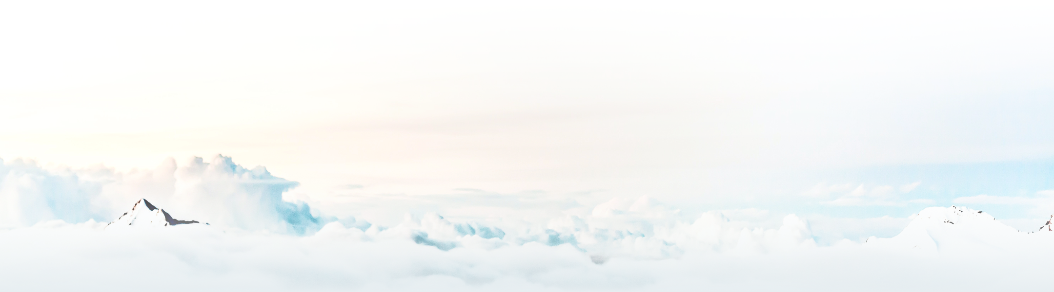 Mountain peaks peeking through the clouds.