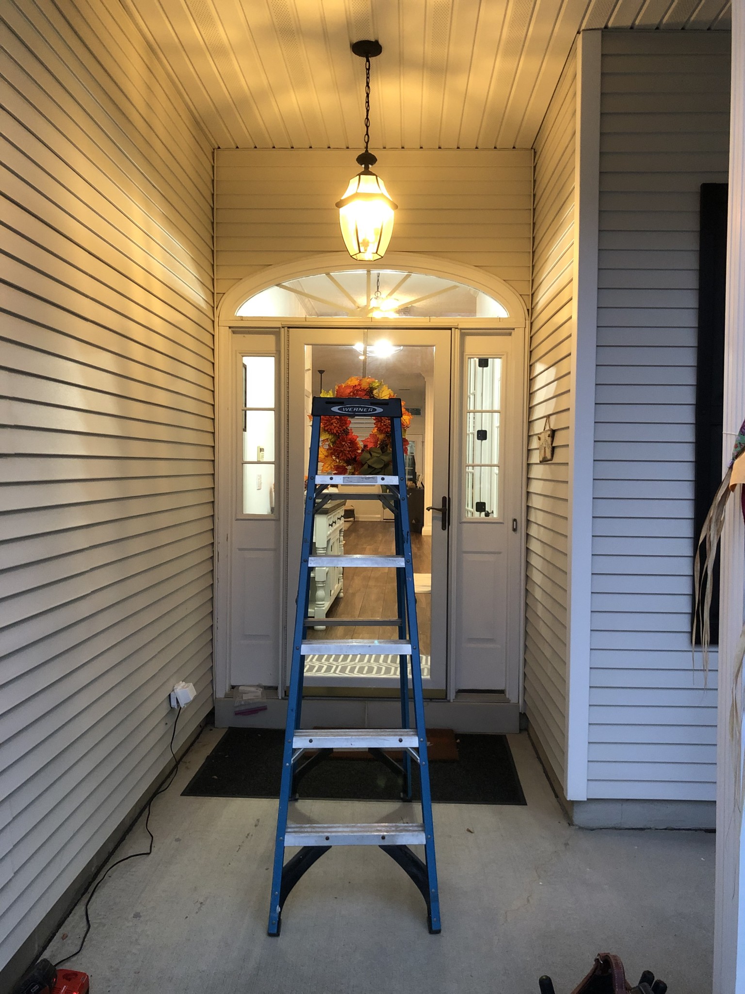 Installed a Hampton Bay electrical fixtures and to brighten up the area. Added Feit Electric 60 watt LED bulbs with a clear glass. The result was a transformed foyer/porch area, bathing in a warm, lovely glow!