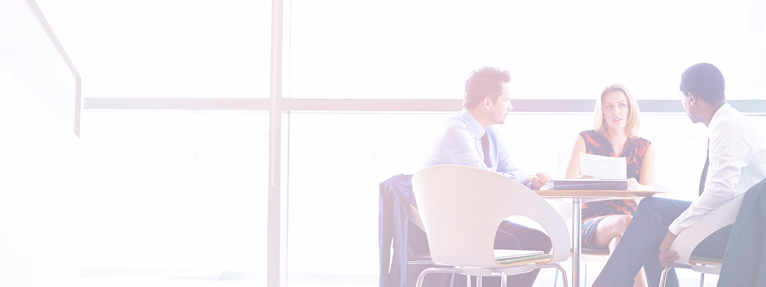 A team of three advisors in a meeting.