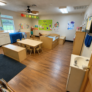 Bright and colorful preschool classroom at Childcare Network with age-appropriate learning materials