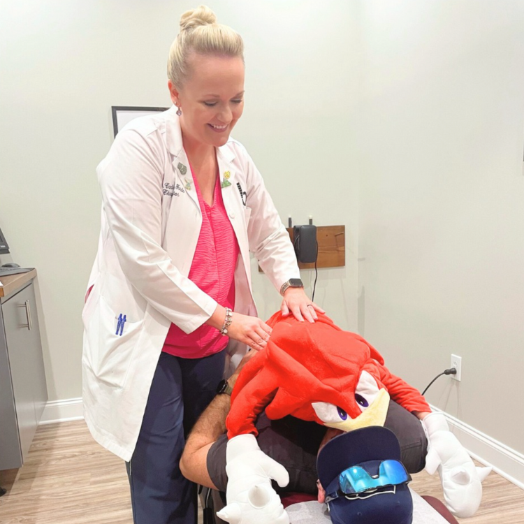 Dr. Candice Forde with chiropractic patient