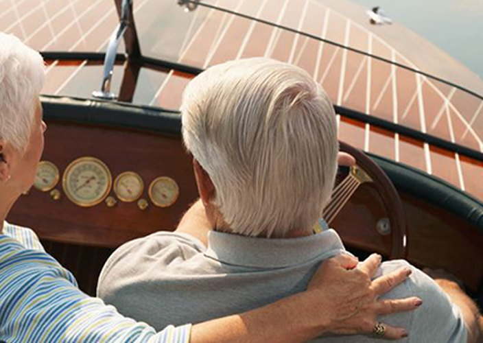 A couple driving their boat.