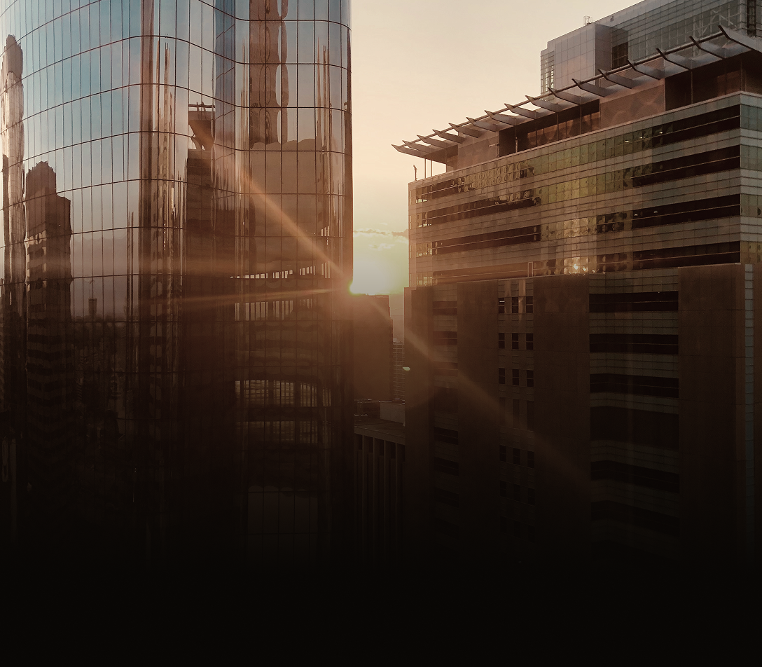 Shot of office buildings with warm light reflecting.