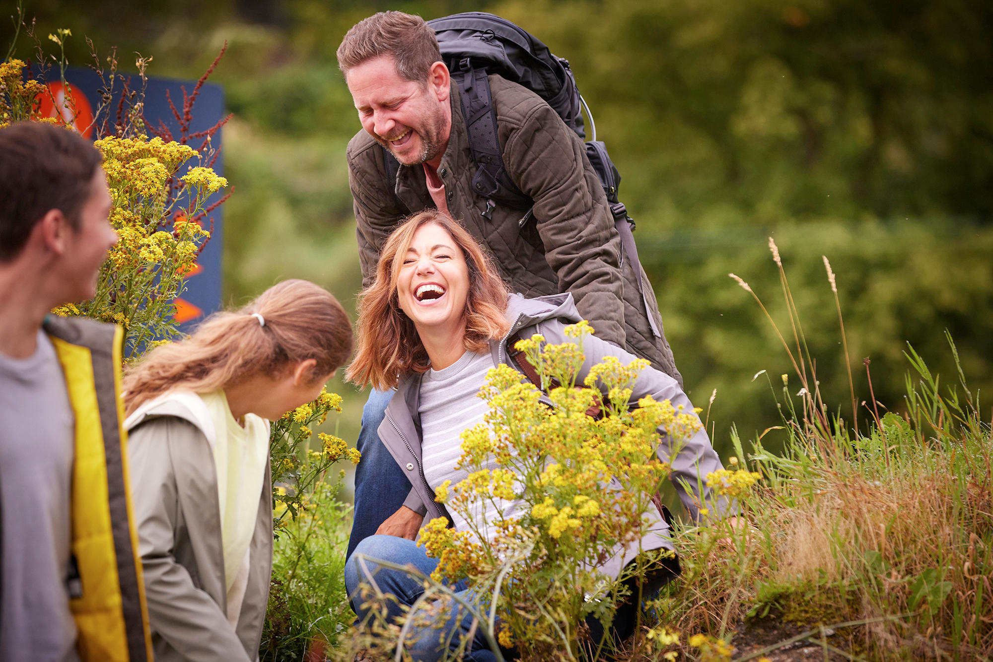 Family laughing while out walking the grounds of Drimsynie Estate