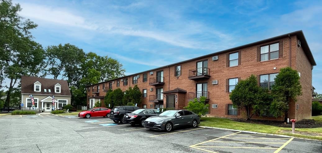 Apartment exterior and parking area.
