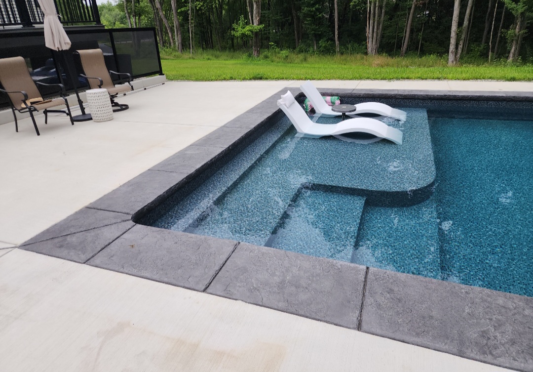 Custom tanning deck on pool in Sharpsville, PA