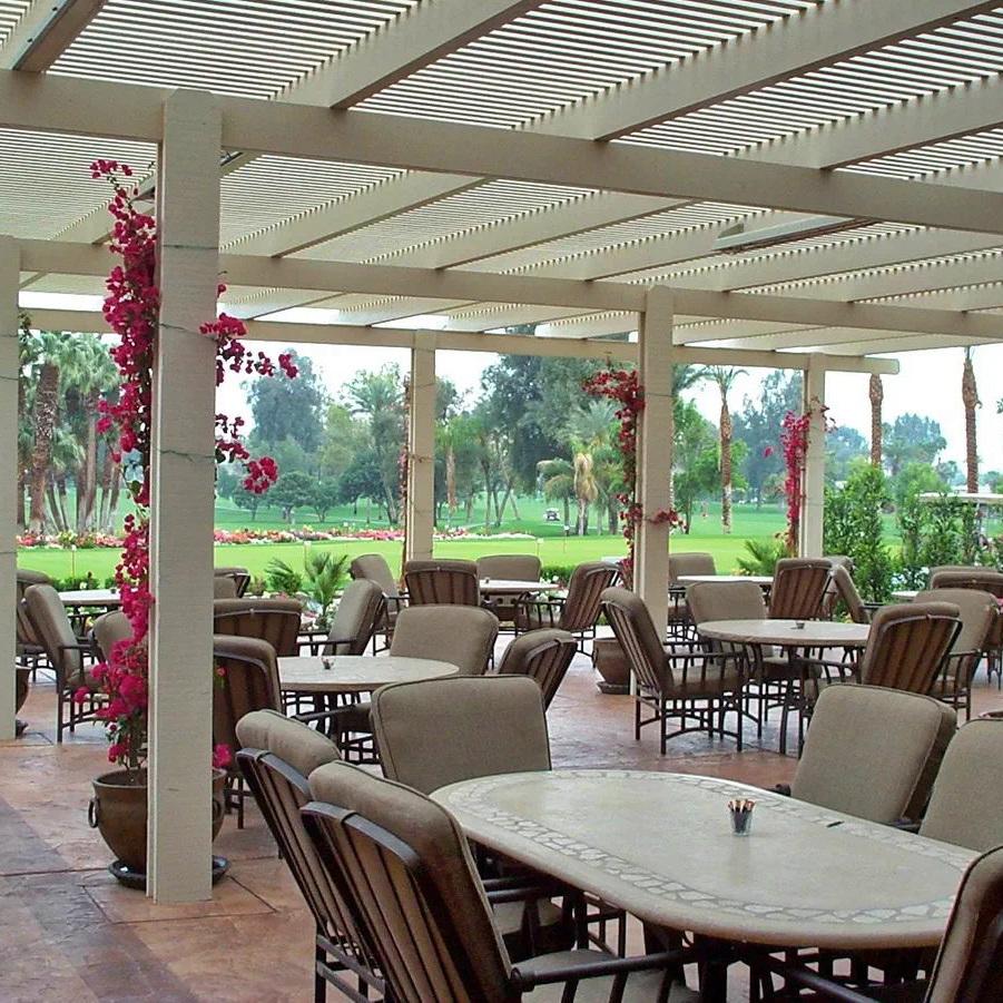 Outdoor dining area covered with large Alumawood shade structure.