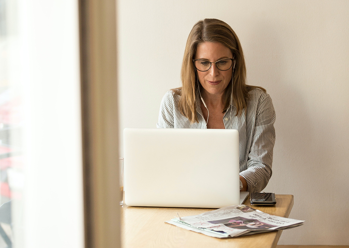 Woman working on her laptop.