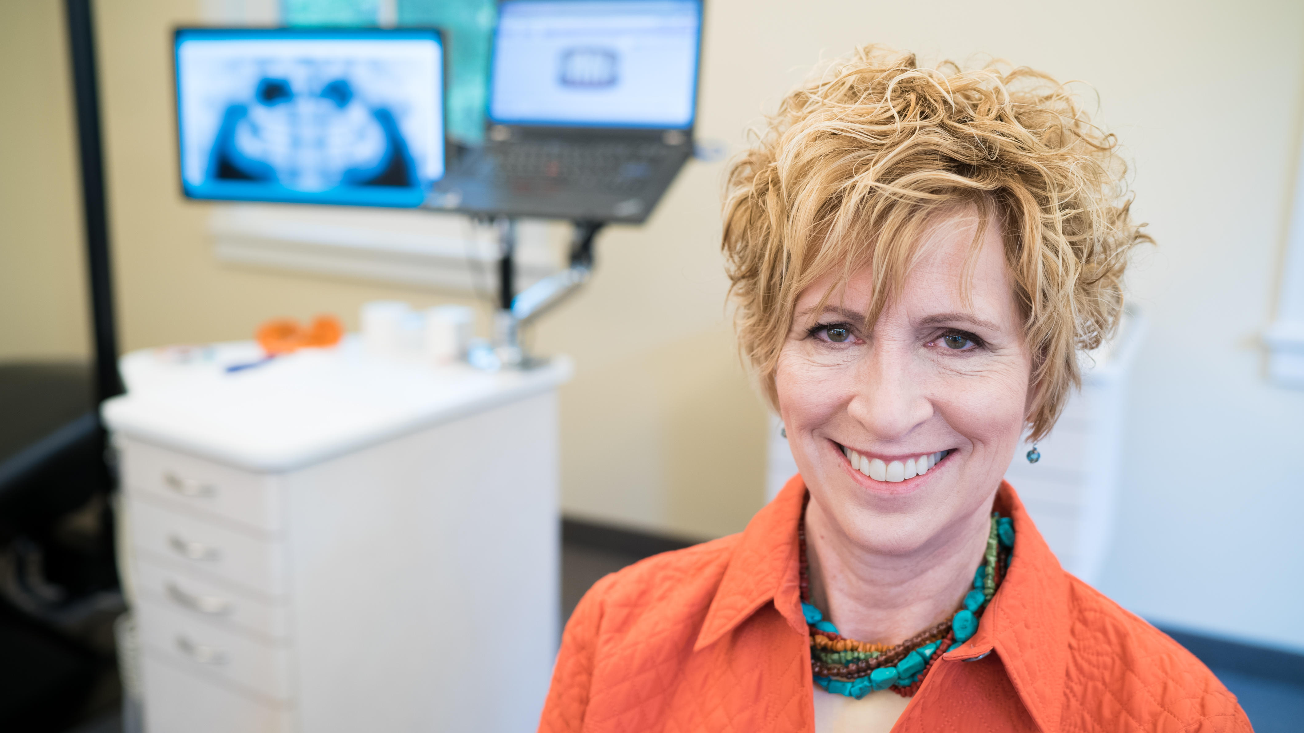 adult woman smiling at cooney orhthodontics office in ballston lake, ny