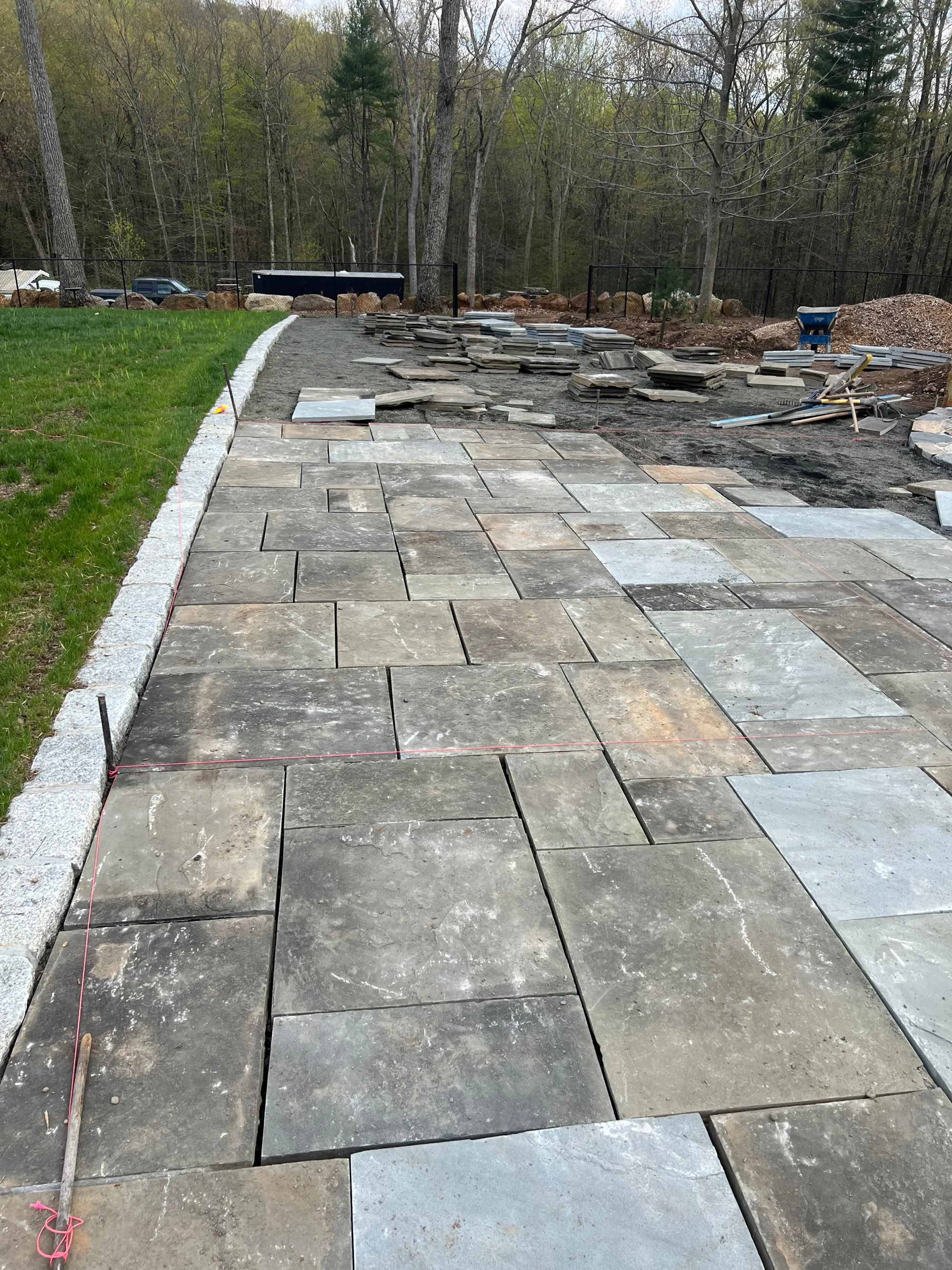 Natural stone patio surface detail - Patios project by General Masonry LLC.