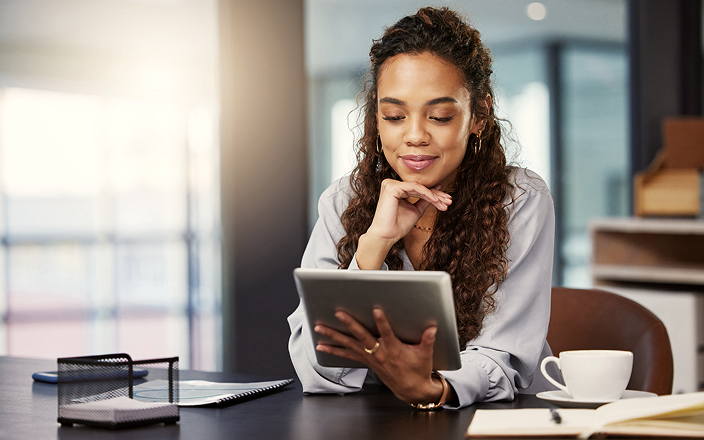 A client reviewing a guide on a tablet from home.