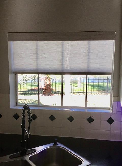 No one likes the sun in their eyes while they're doing dishes. This Sugar Land, TX homeowner knew Roller Shades by Budget Blinds of Katy & Sugar Land were the perfect solution to make her kitchen more functional. #BudgetBlindsKatySugarLand #RollerShades #ShadesOfBeauty #FreeConsultation #WindowWedne