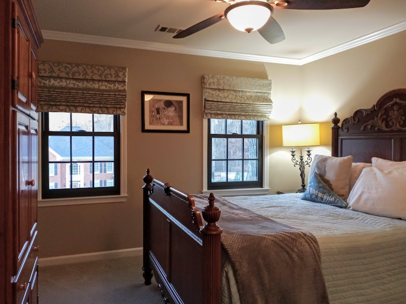 We design our window treatments to go with your style, whether modern, traditional, eclectic or otherwise. For this room we went with a traditional color and pattern in the Roman Shade to complement the beautiful traditional wood bed set.