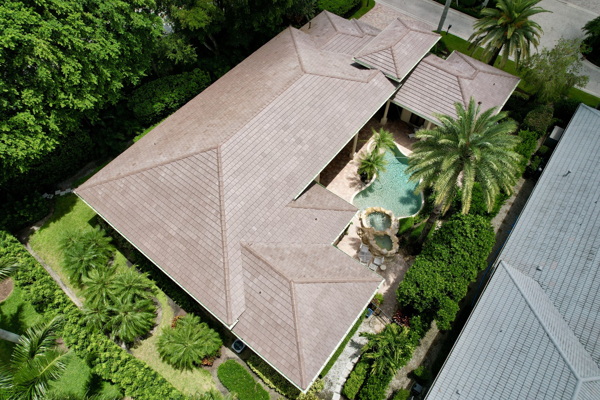 We replaced this roof and installed a flat tile from Eagle. This tile color is called Cocoa Range.