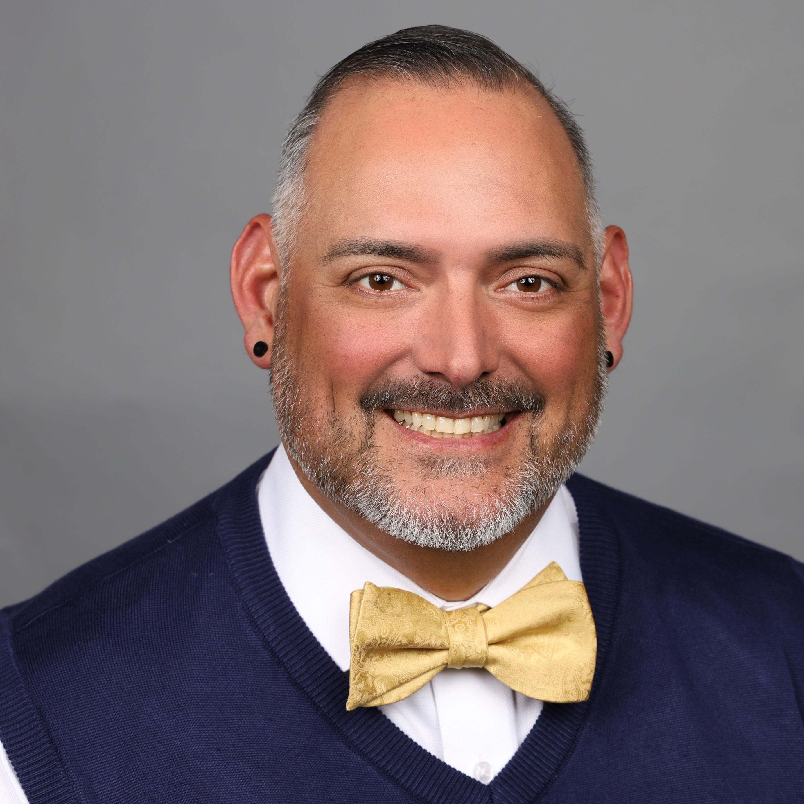 Man wearing a vest and bowtie