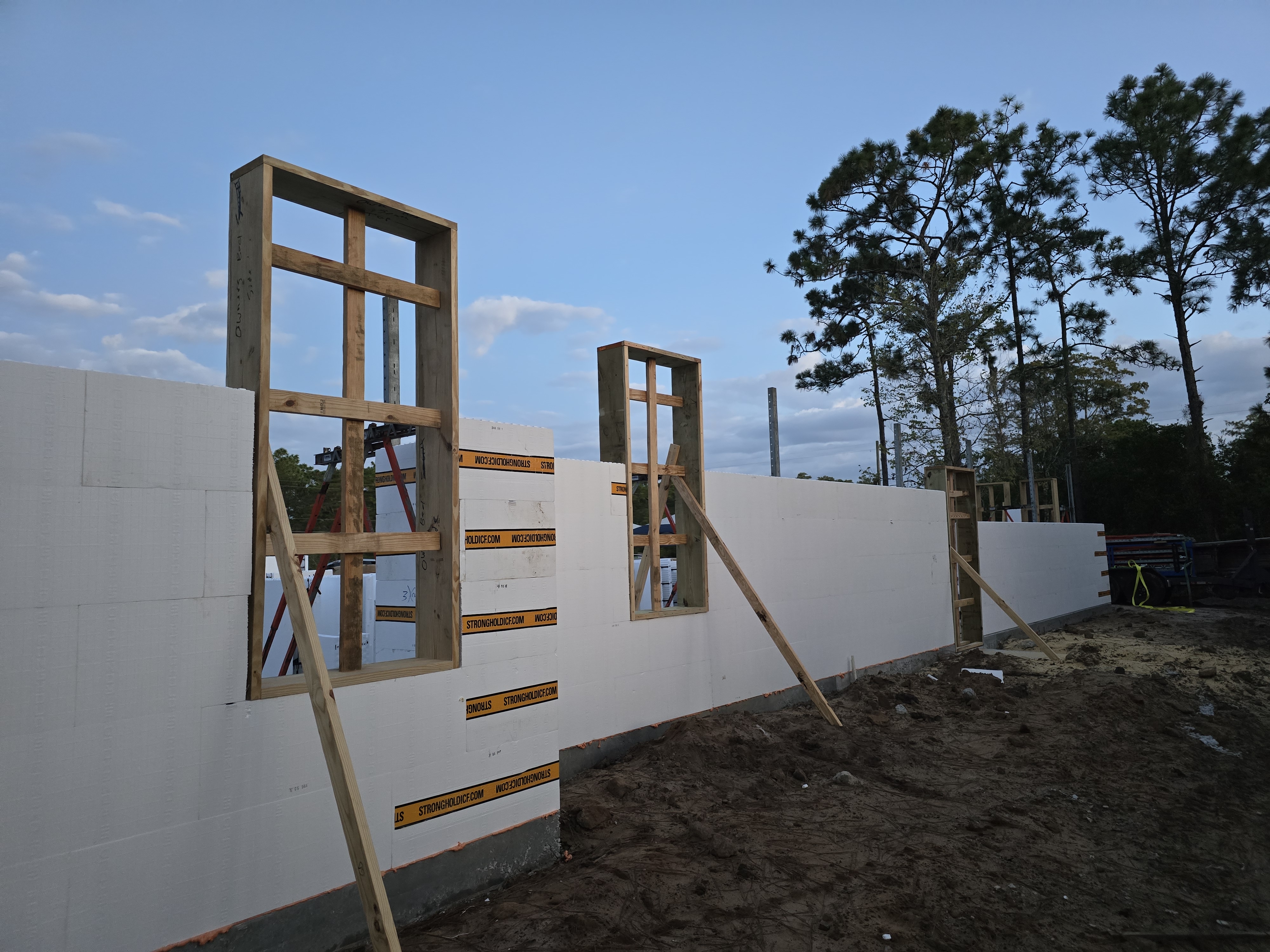 A construction site with insulated concrete forms (ICFs) being used to build the foundation of a str 