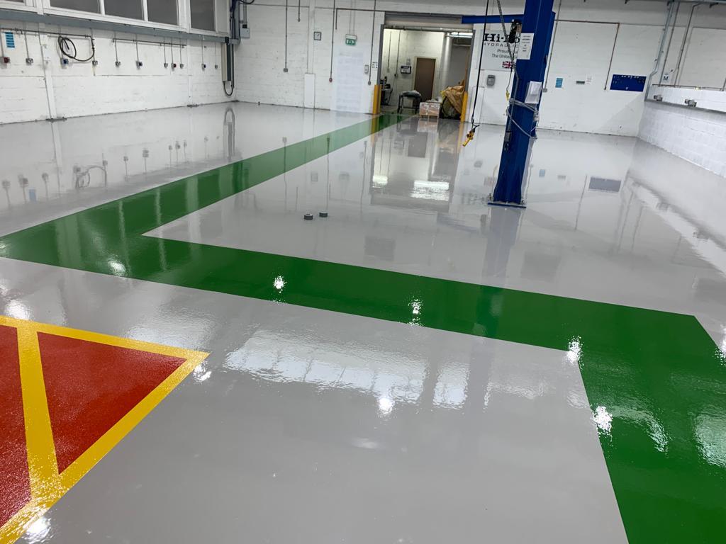 Grey resin flooring with green gangway Monarch Resin Floors Ltd Dronfield 01246 412222