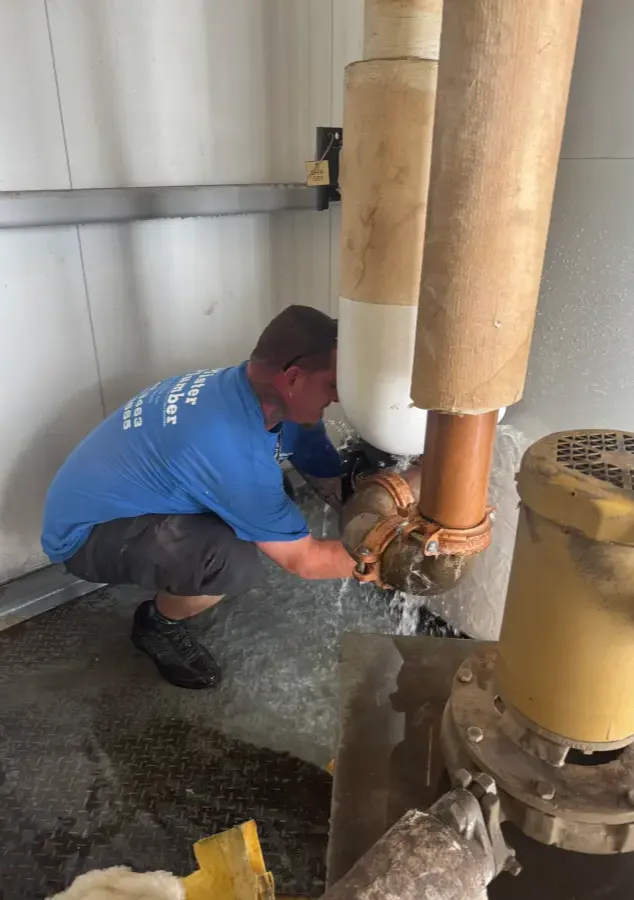 Repairing a commercial water heater. 