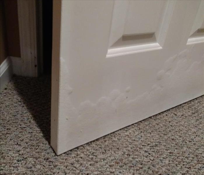 Warped Door as a Result of Flooding