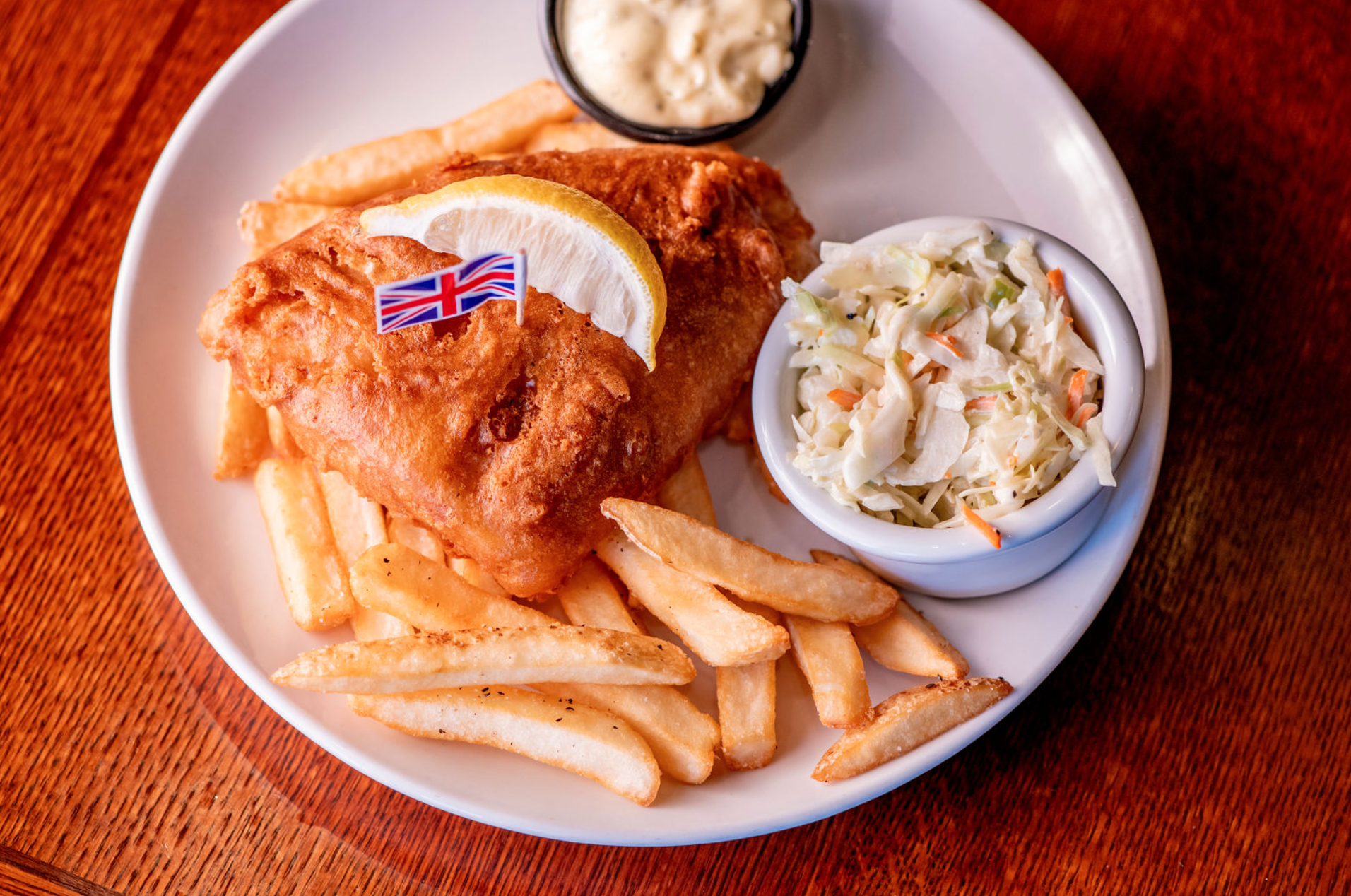 Wee portion of our award-winning, beer-battered haddock, housemade tartar sauce, & creamy coleslaw