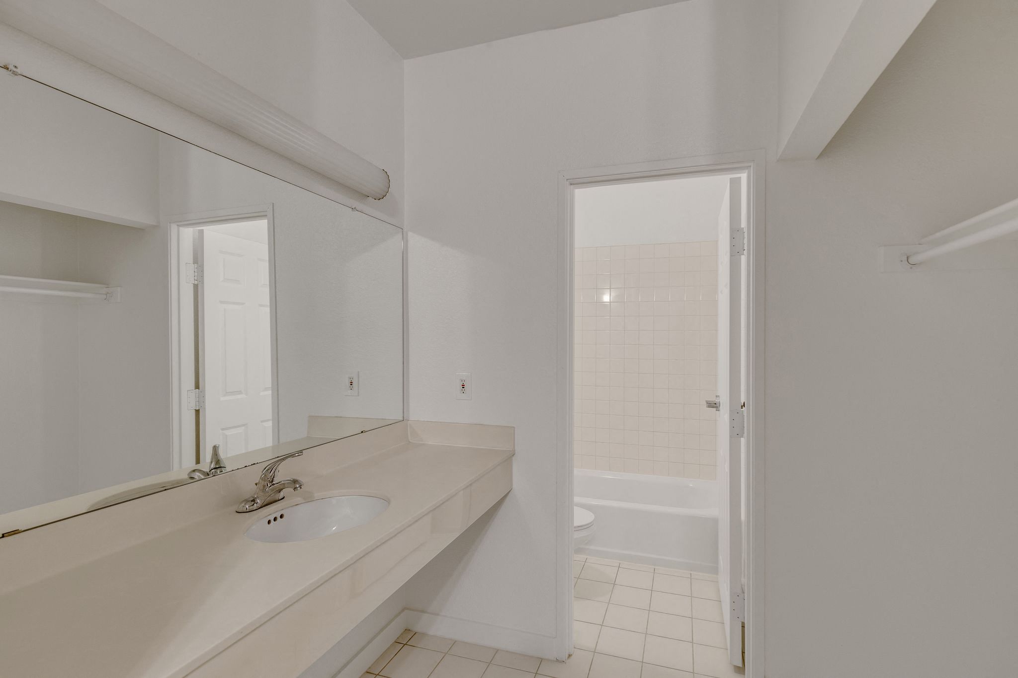 a bathroom with a tub and a toilet and a sink 