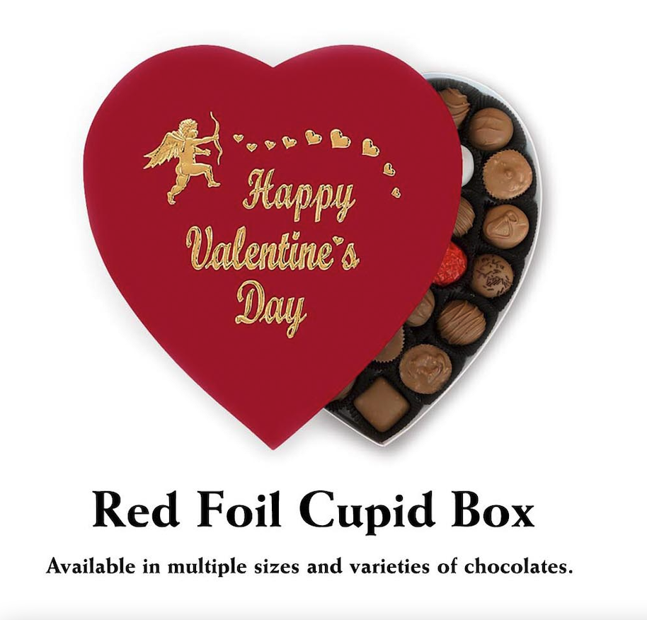 A Valentine's Day-themed table featuring Florence's Exquisite Chocolates in Rexburg, Idaho. The table is adorned with multiple heart-shaped boxes, available in sizes of 4, 6, 12, and 24 pieces, all tied with elegant red ribbons. Each box contains a variety of chocolates, including Milk Chocolate, Dark Chocolate, Milk and Dark Chocolate, as well as assorted chocolates like Assorted Chocolates or Nuts and Caramels. Romantic touches like red roses, heart-themed plates, festive napkins, and decorative candy bowls filled with chocolate truffles and candies are arranged around the boxes. This warm and inviting setup highlights Florence's chocolates as the perfect gift for Valentine’s Day.