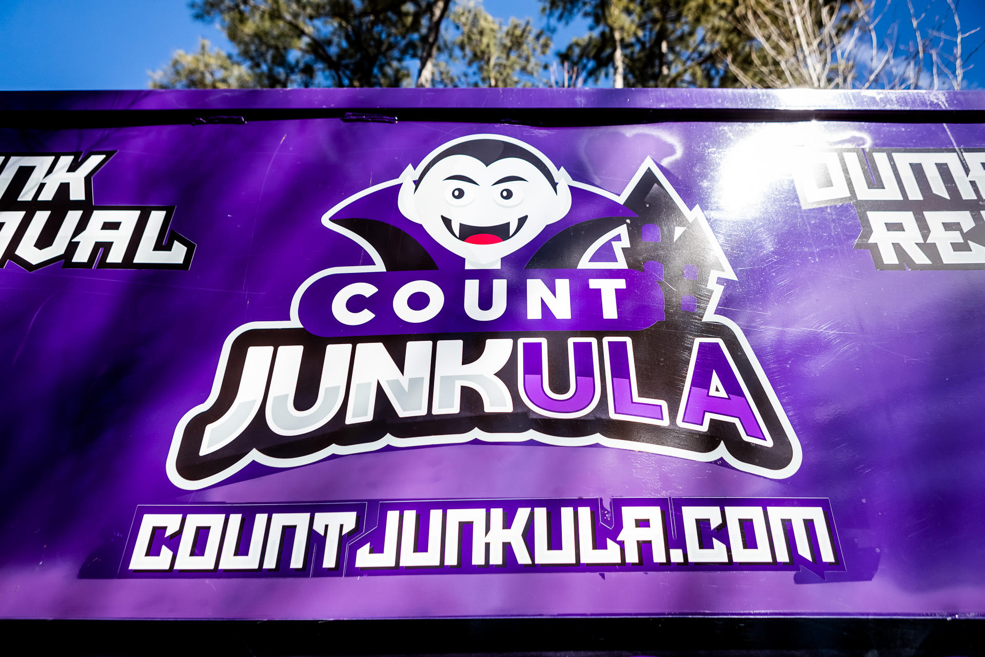 count junkula of raleigh junk removal dumpster logo