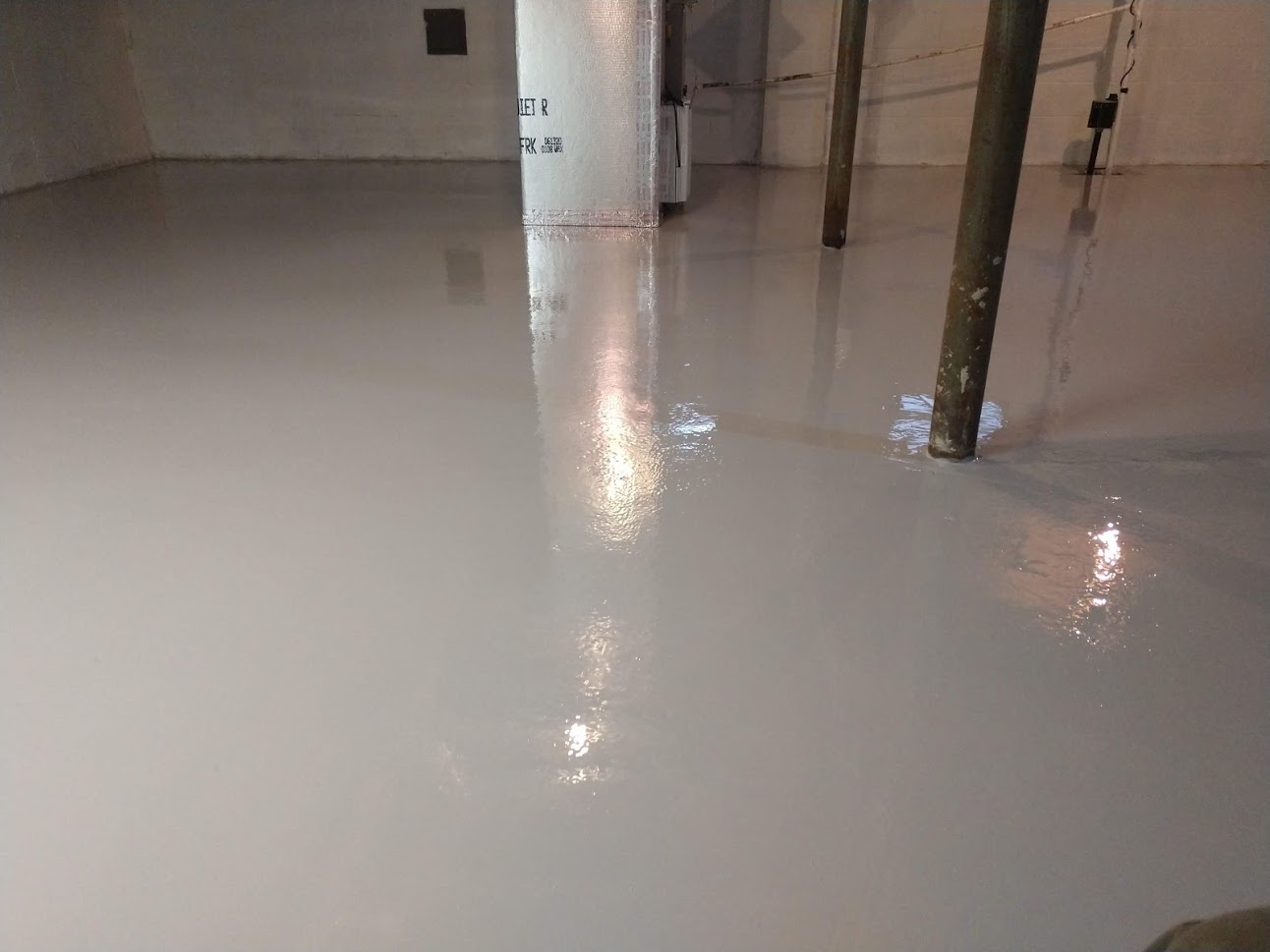 Custom Epoxy solid surface finish basement floor in State College, PA