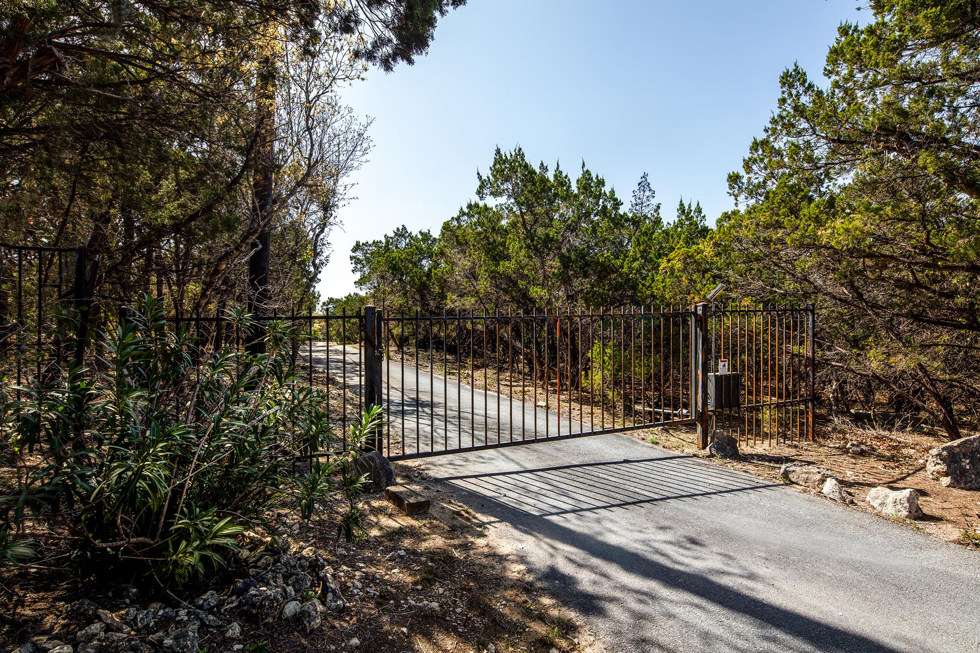 Private drive and pines. Residential roofing services by Schulte Roofing of San Antonio TX.