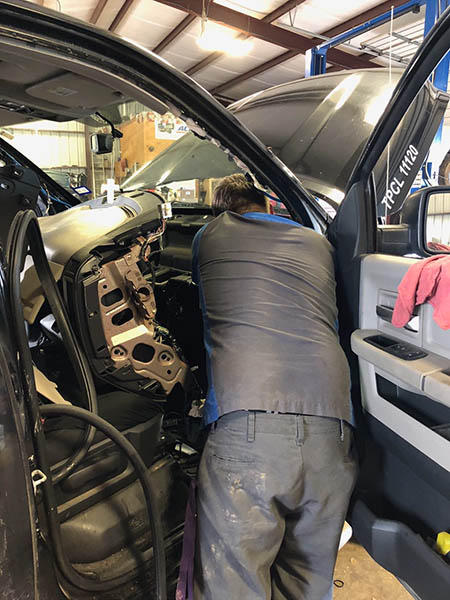 C H Auto Repair mechanic at work.