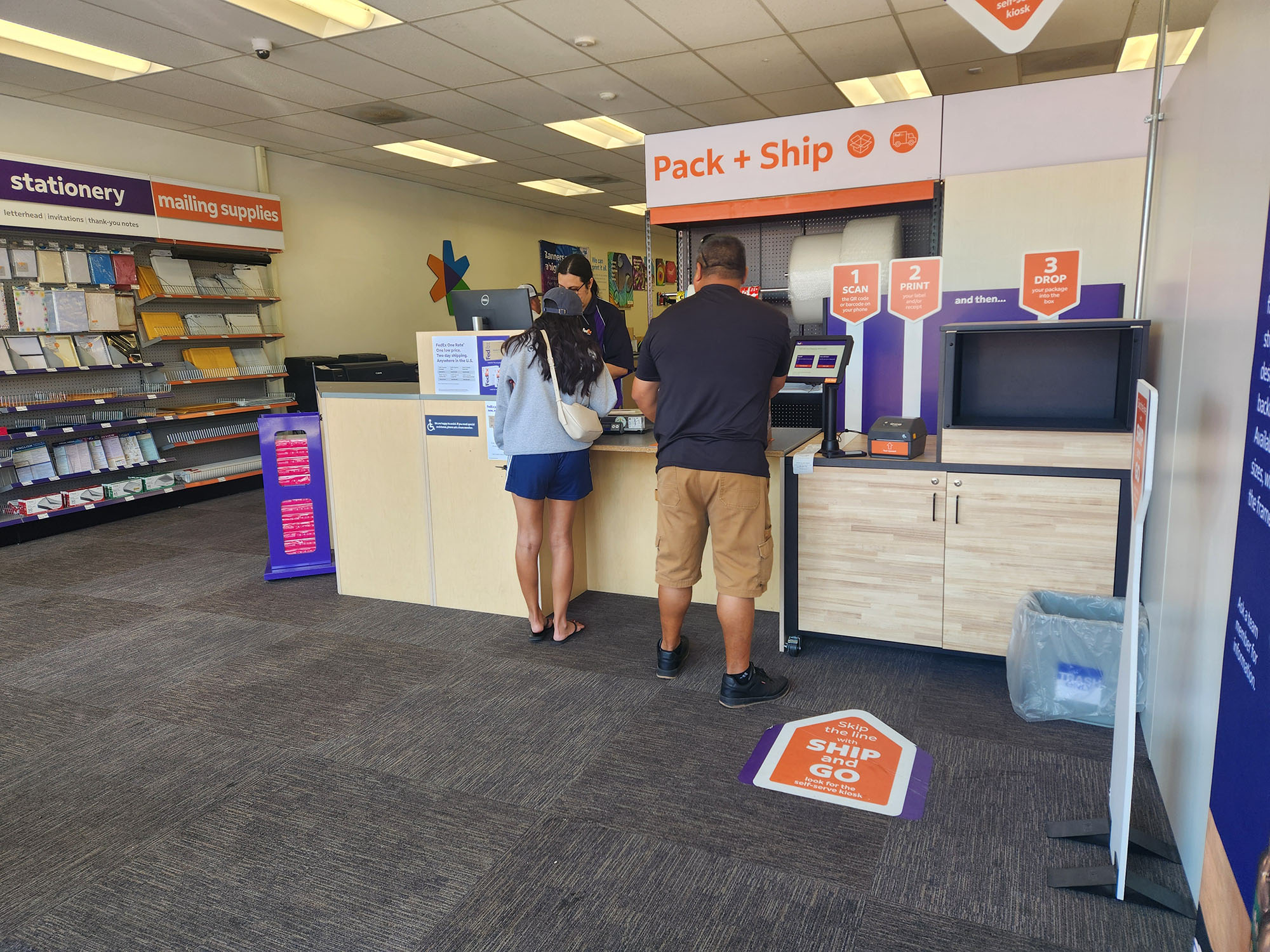 Pack and Ship Counter Area &ndash; Pack and ship service counter at FedEx Office Downtown Riverside CA with staff assisting customers with shipping, returns, and packaging.