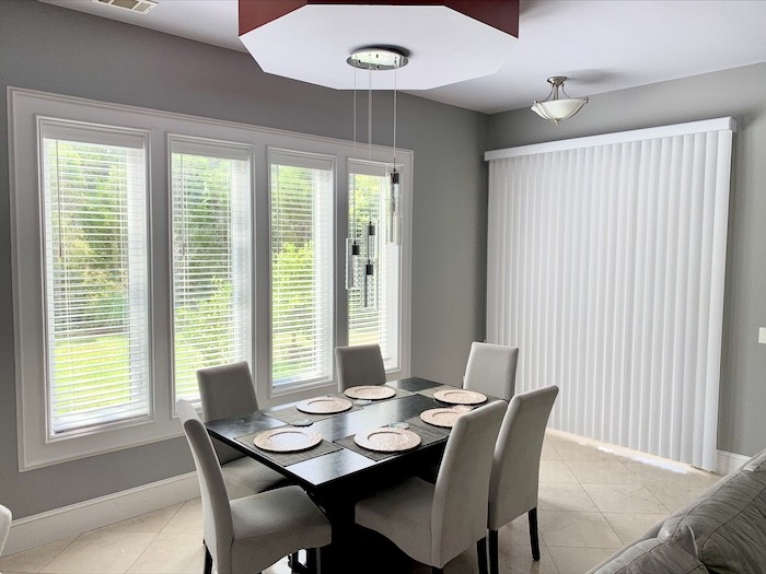 Summer dinner gatherings have never been better! Notice how these sleek wood blinds complement the modern appearance of this local dining room, while providing ample privacy. Plus, our gorgeous wood blinds are seamless to use, so you can enjoy our stunning Lowcountry views and natural light flow wit