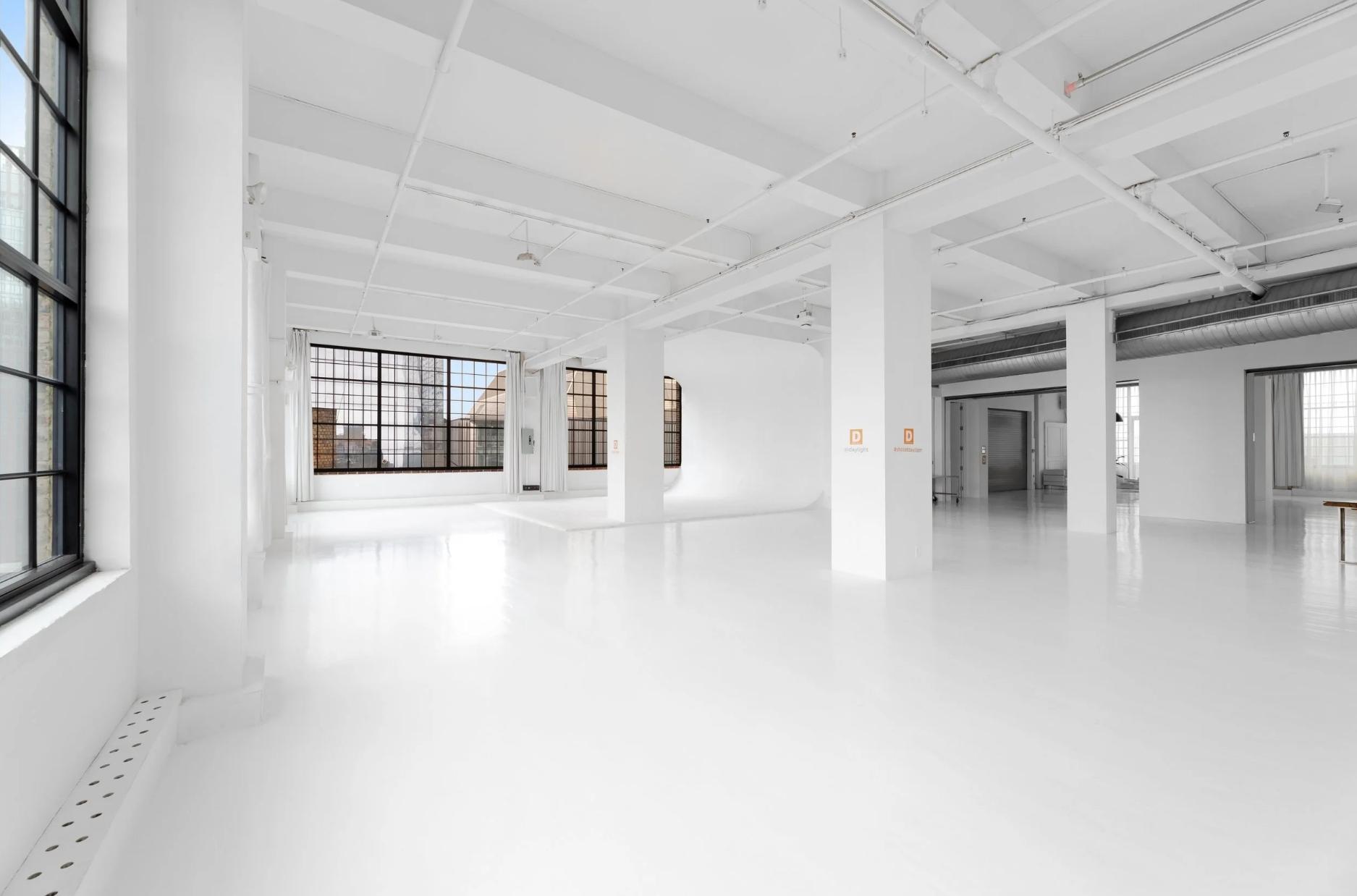 4,500 SF Studio 3, Venue Hudson Yards NYC, factory sash windows, natural daylight, white floors, 15' ceiling, exposed ductwork, open floor plan, photo and video studio rental New York.