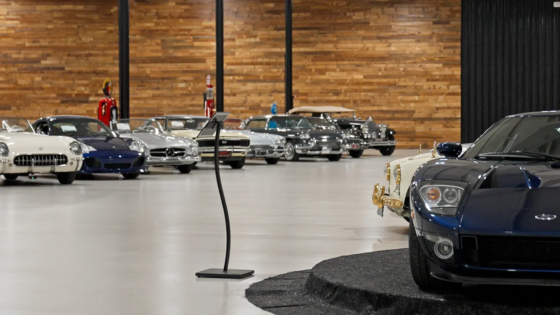 Classic and collector automobiles displayed inside the Kruse Auctions facility in Auburn, Indiana.