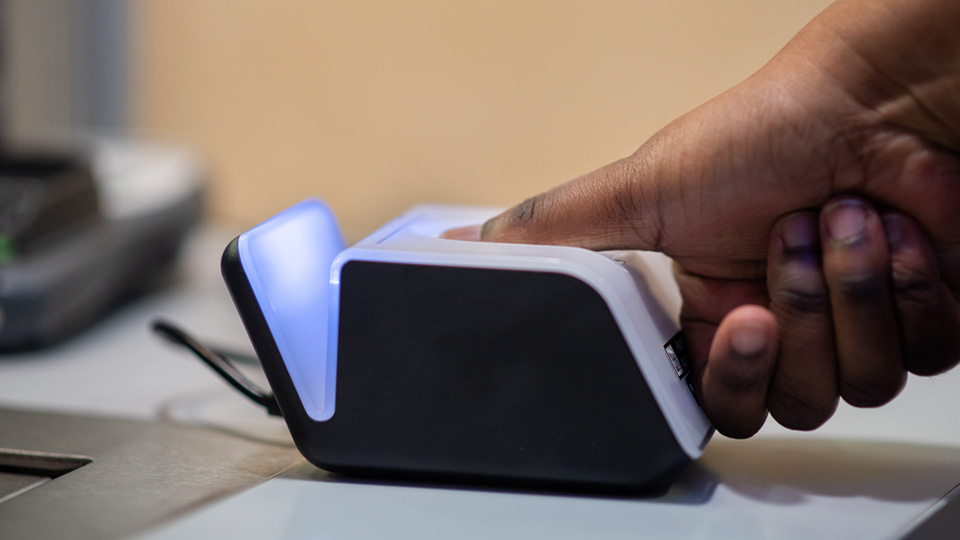 Finger being scanned with a fingerprint scanner