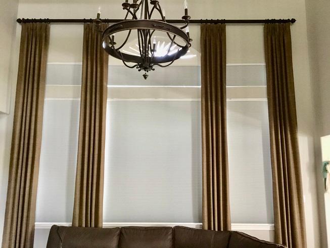 Completely revamp the style of your Richmond, TX home with our Cellular Shades. They look great in lower windows and transom windows with Custom Drapery Panels on a rod!
