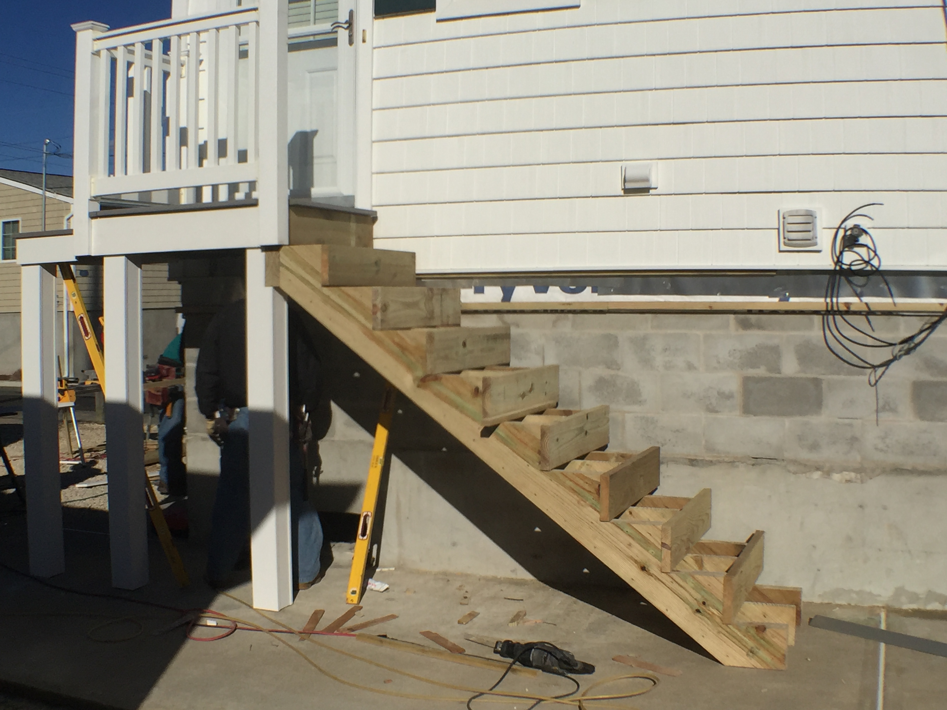 Ocean Beach Cottage - custom stairs are being made to accommodate the houses' new height