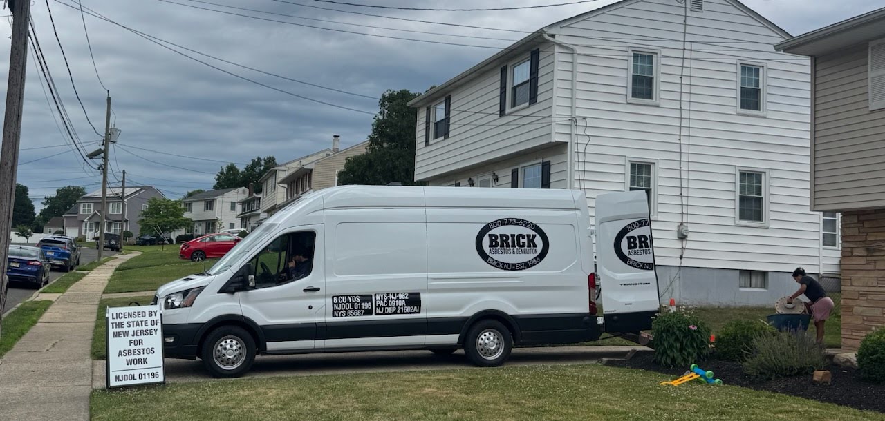 Branded Brick Asbestos & Demolition service van parked outdoors, highlighting the company’s professional asbestos and demolition service vehicle.
