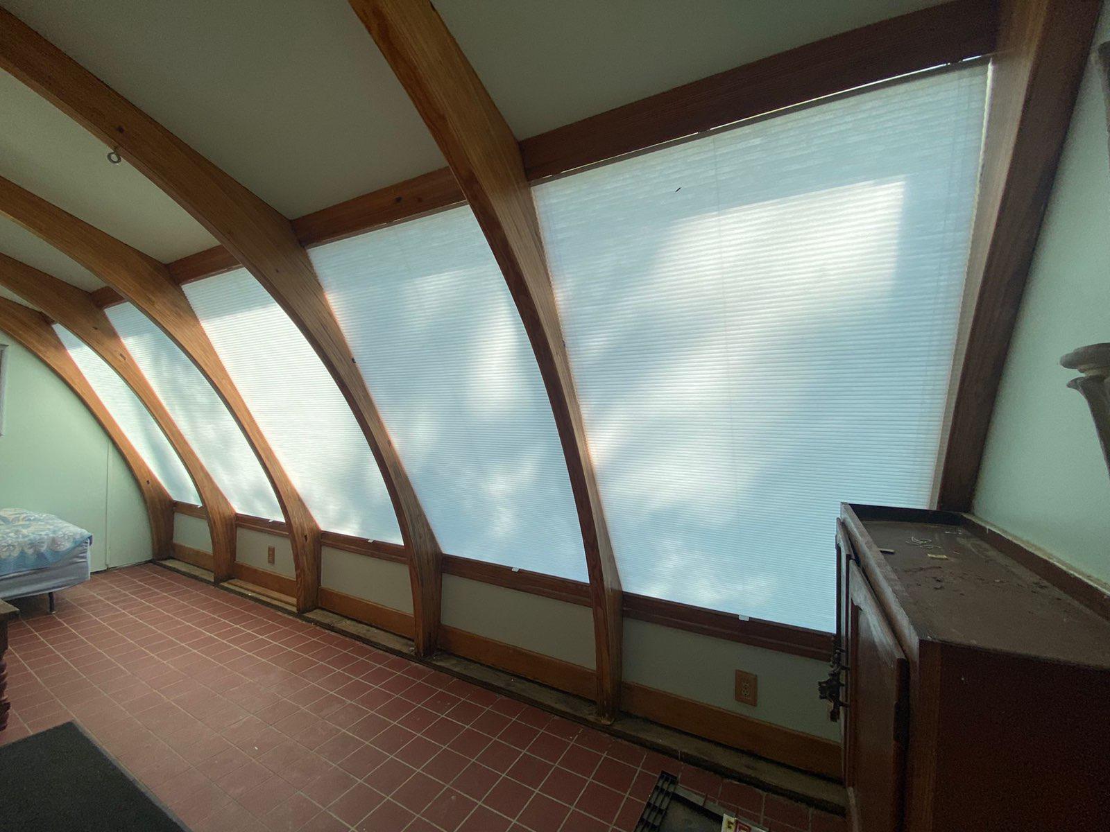 Converting a sunroom into a bedroom or another type of space? Or maybe you just want a little more shade! We added shade here in this Stephentown sunroom with our Cellular Shades, which work great on slanted windows!