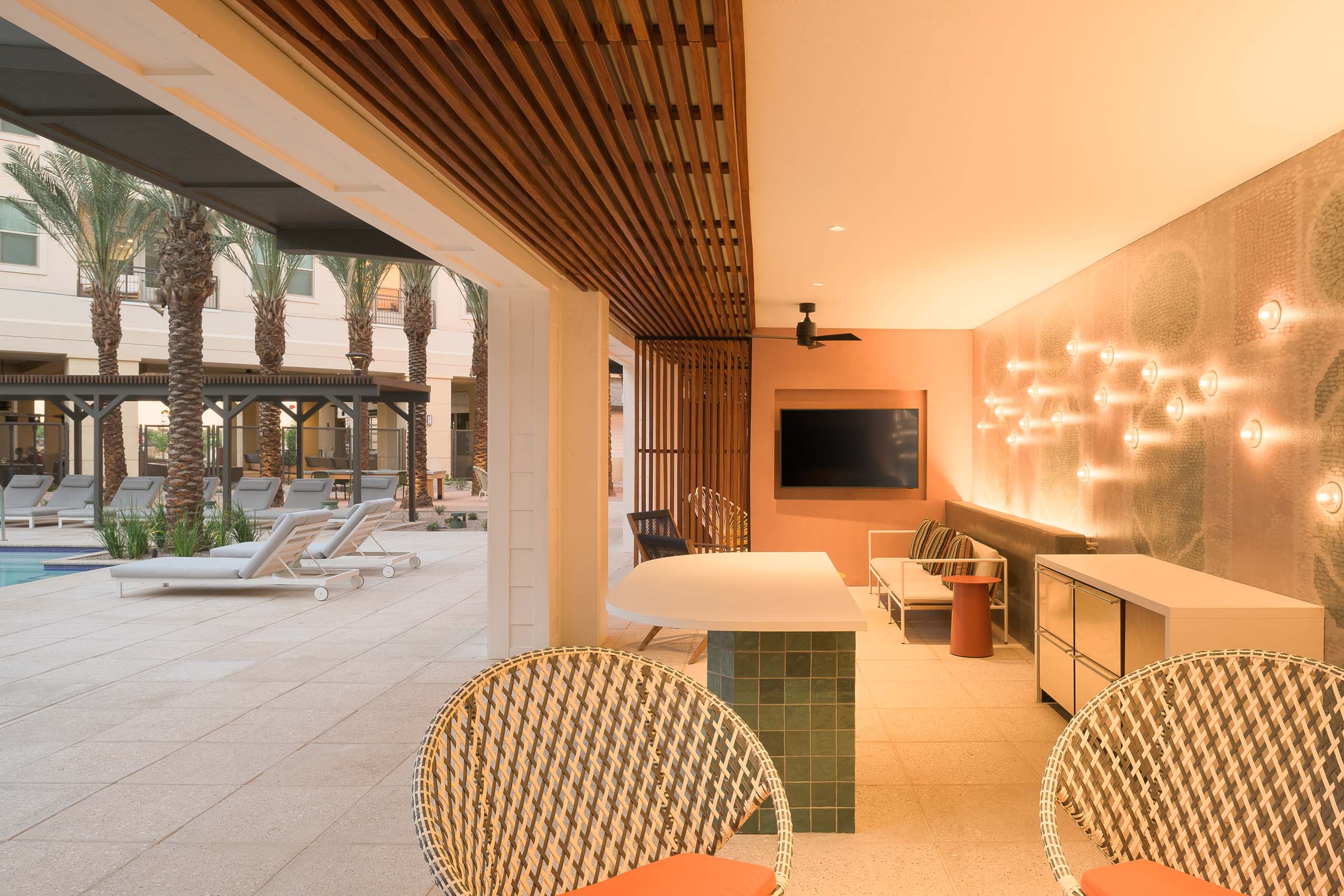 Poolside large cabana with tv and covered seating at Camden Gilbert apartment homes in Gilbert, AZ